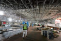 Work continues in the hanger area during a tour of the under-construction aircraft carrier, HMS Prince of Wales, at BAE Systems in Rosyth, Fife. PRESS ASSOCIATION