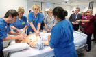Scottish Finance Secretary Derek Mackay (second right) watches a teaching session on cardio-pulmonary resuscitation (CPR) in a simulated ward environment at the teaching and Learning Centre, Queen Elizabeth University Hospital, Glasgow.