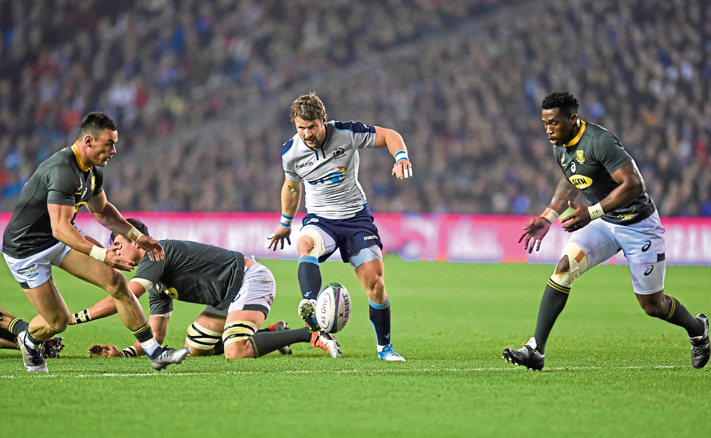 Scotland's Peter Horne hacks the ball on with Jesse Kriel and Siya Kolisi of South Africa looking on during the Autumn International match at BT Murrayfield, Edinburgh. PRESS ASSOCIATION Photo. Picture date: Saturday November 17, 2018. See PA story RUGBYU Scotland. Photo credit should read: Ian Rutherford/PA Wire. RESTRICTIONS: Editorial use only, No commercial use without prior permission