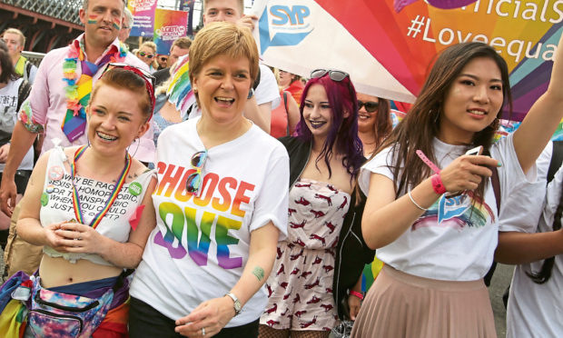 First Minister of Scotland Nicola Sturgeon joins 
people taking part in Pride Glasgow