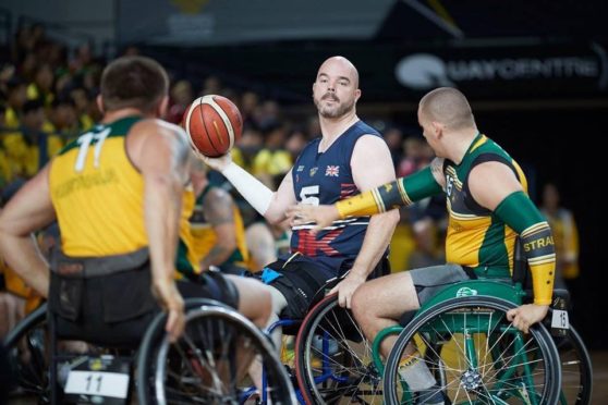Michael Mellon in action with the wheelchair basketball team. Picture by Theo Cohen.