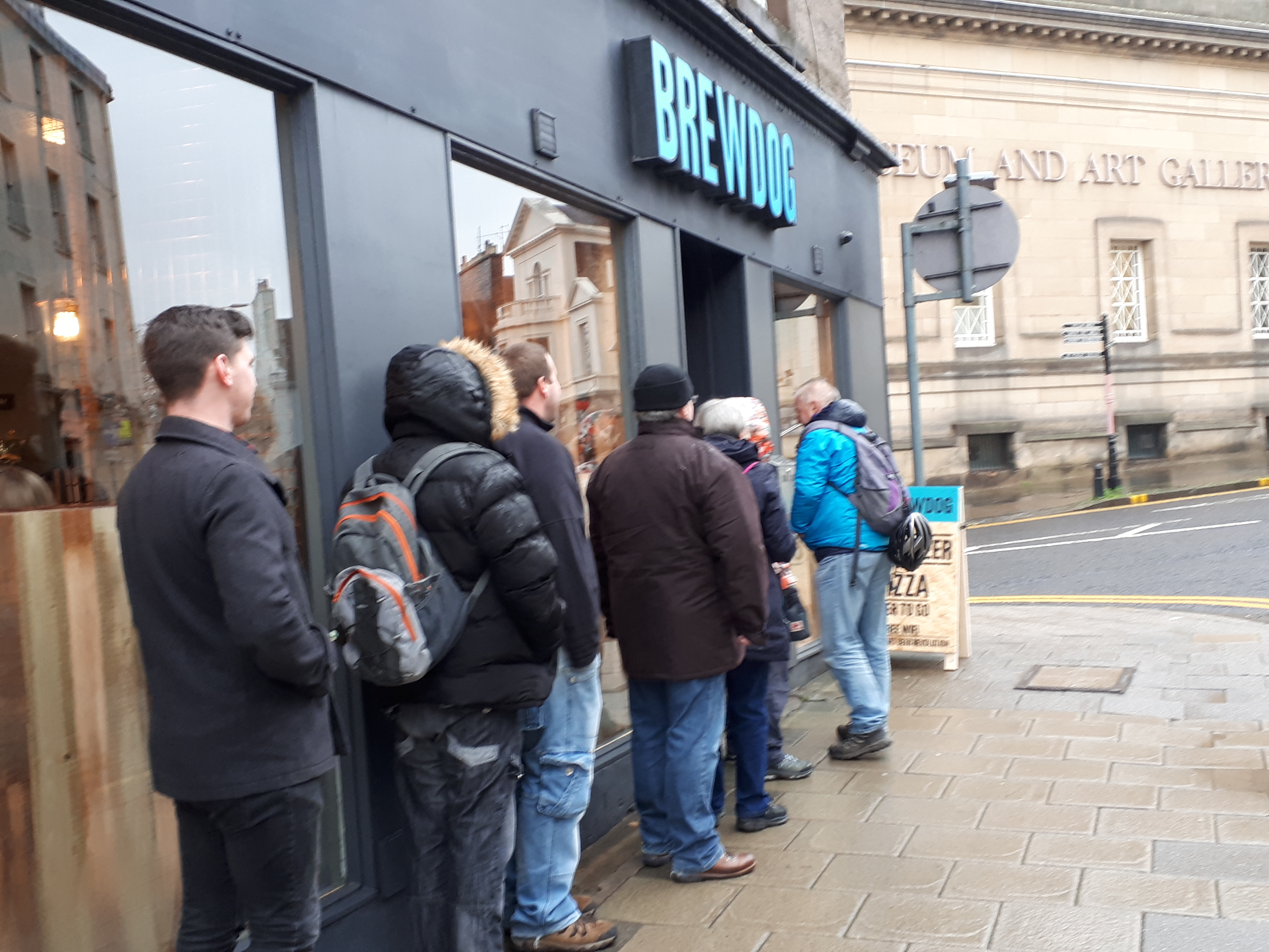 Beer fans queuing outside Brewdog an hour before opening.