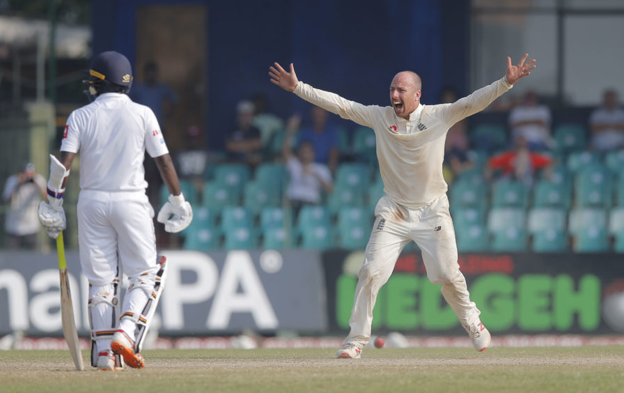 England's Jack Leach, right, successfully appeals to dismiss Sri Lanka's Suranga Lakmal as non striker Malinda Pushpakumara watches during the fourth day of the third test cricket match between Sri Lanka and England.