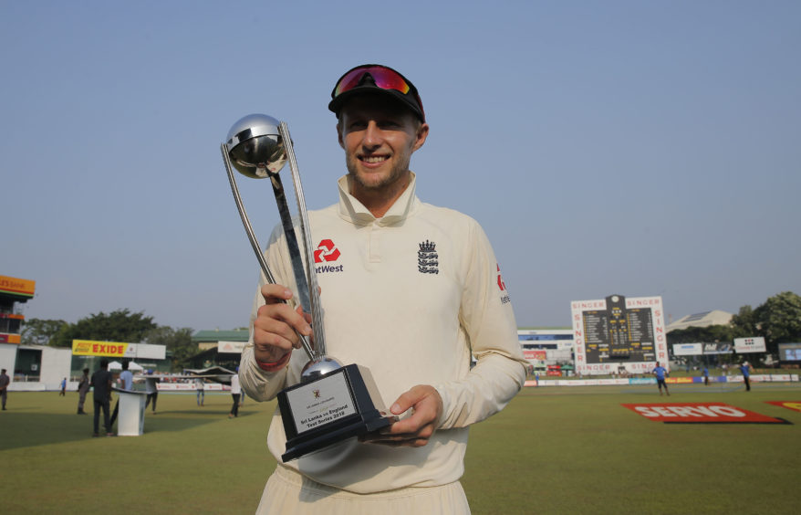 England cricket team captain Joe Root pose with winners trophy after the third test cricket match between Sri Lanka and England in Colombo.