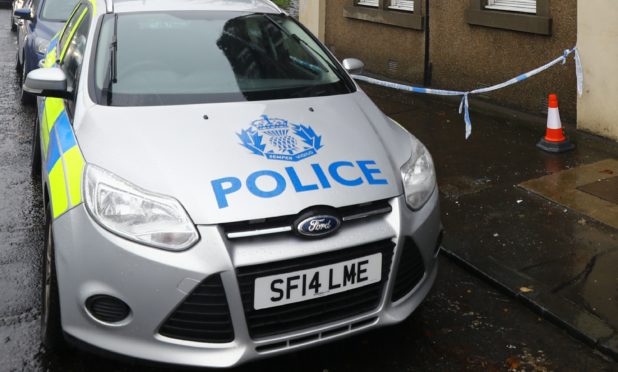 A police car outside the flat where the incident took place.