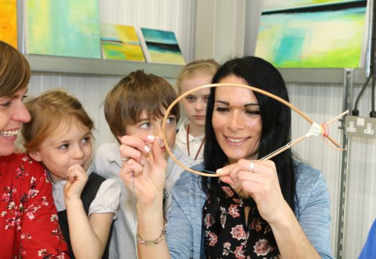 Gayle makes a dreamcatcher at an Explore Play Create workshop run by Victoria Wylie and Rachel Bower.