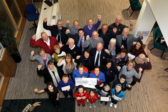 Recipient representatives and CGLMC figures at the Links House handover