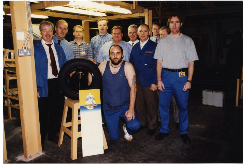 John Greig and colleagues with Michelin's anniversary tyre on 6/11/1997.