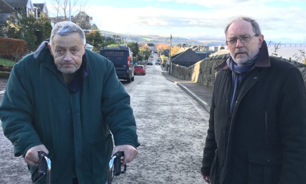 Brian Leighton, with Cllr Tim Brett, is worried about the removal of a grit bin from his Newport street