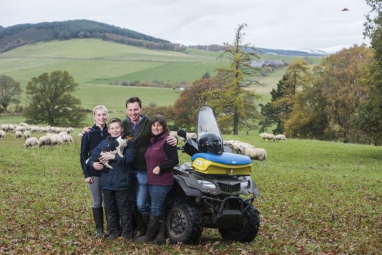 Neil and Debbie McGowan on their farm, Incheoch, with children Tally and Angus and dog Skye.