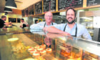 Owner Jonathon Clark (right) with father Alan Clark in the bakery shop on Annfield Street.
