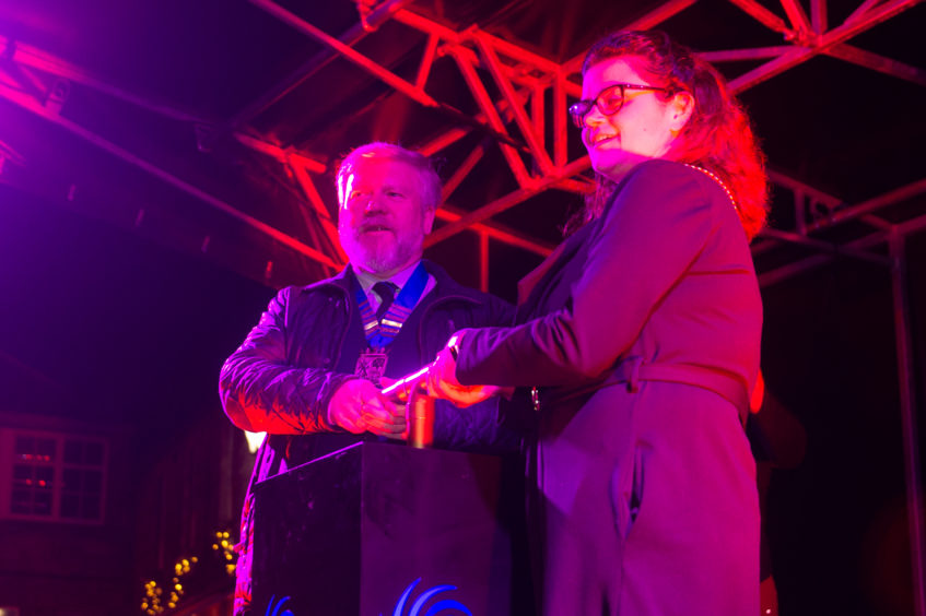 Callum McLeod, Chair of the Community Council,  and Depute Provosot for Fife Julie Ford switch on the lights.