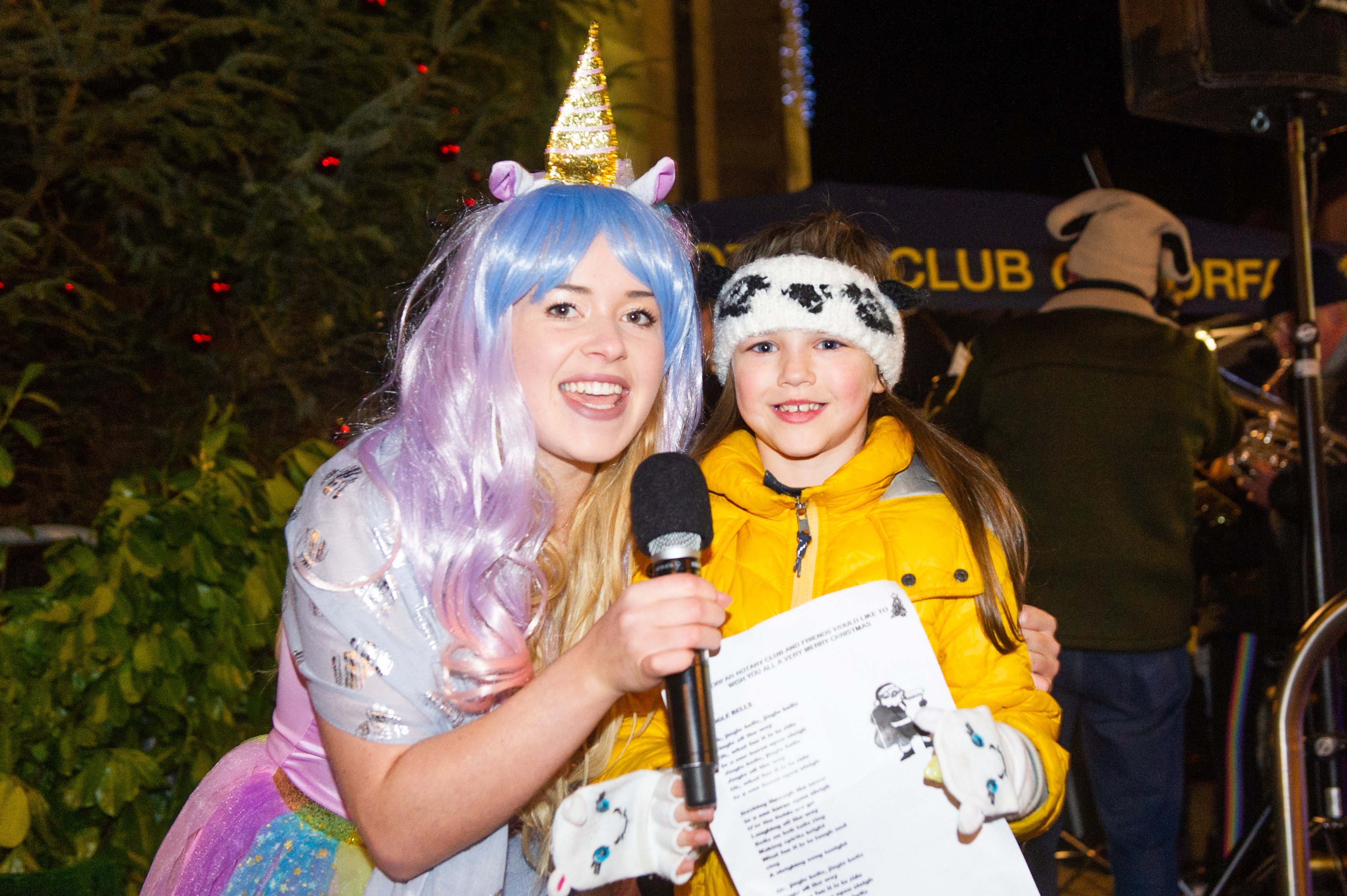 Princess Unicorn Chloe Leuchars and six-year-old Aimee Carr sing at The Cross