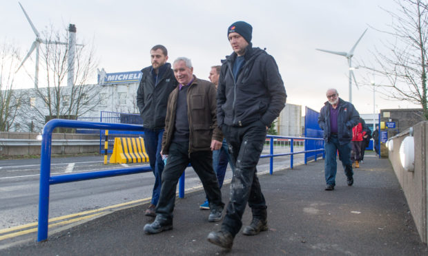 Michelin Dundee staff leaving at the end of their shift on Friday.