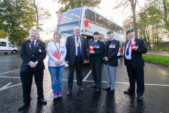 Christine Evans (Area Organiser for Poppy Scotland) and Provost Jim Leishman  with the new bus decorated in remembrance poppies, Pittencrieff Park, Dunfermline, 30th October 2018.