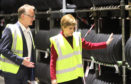 John Reid, Michelin Dundee manager, and Nicola Sturgeon at the factory in June 2017.