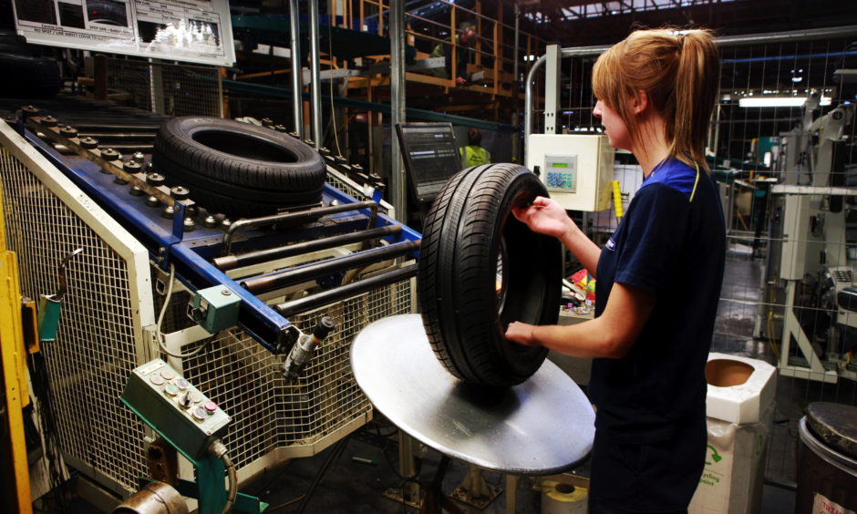 A Michelin Dundee technician checks a tyre
