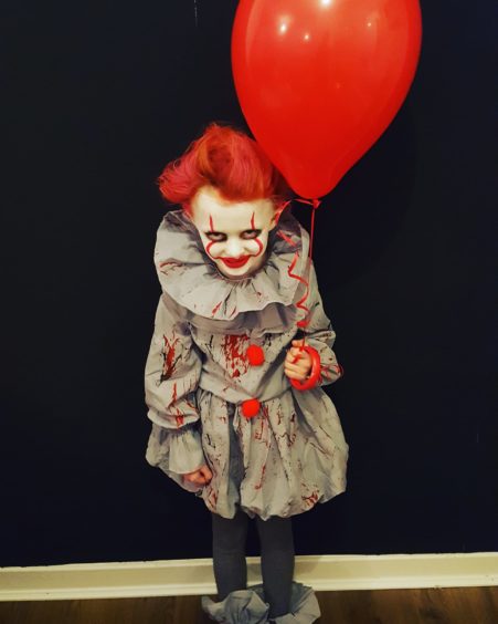 Have you seen a better Pennywise costume than this one worn by Lola, 5?