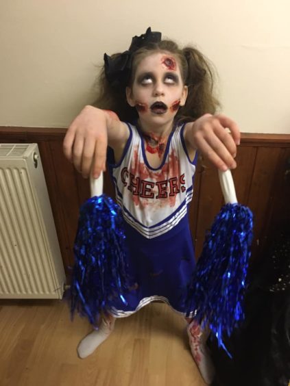 Madison looked the part as a zombie cheerleader.