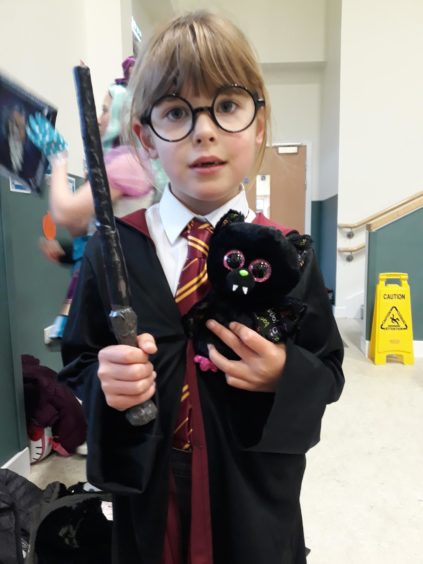 We're told Morgan, 6, didn't want to dress as Hermione - so she went as Harry Potter instead!