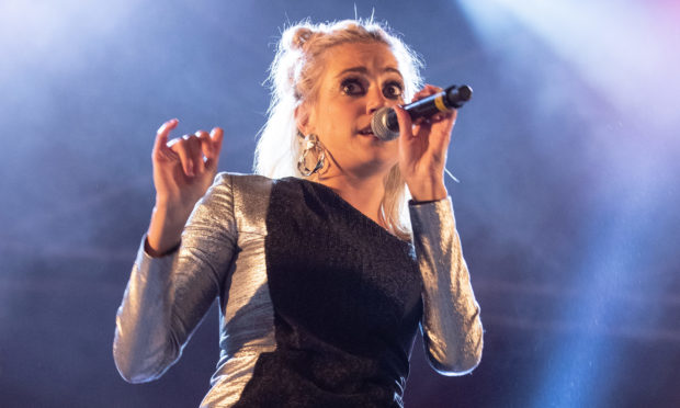 Pixie Lott performs on the Main Stage during the Christmas lights switch-on event.