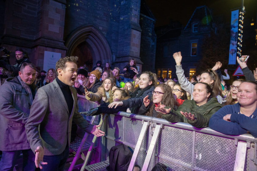 Stephen Mulhern meets and has selfies with the public during the City of Perth Winter Festival.