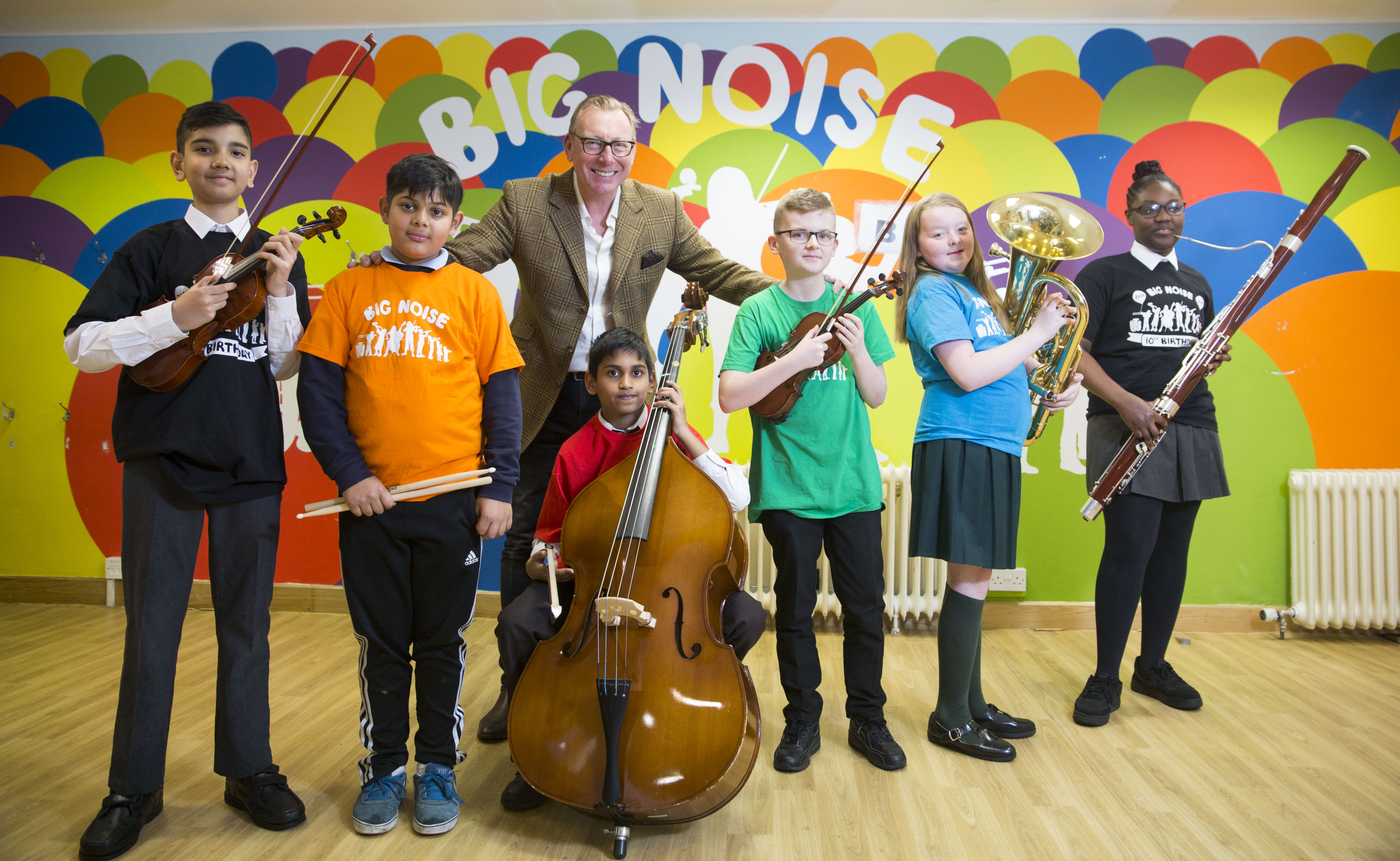 Benny Higgins with children from the Big Noise Govanhill orchestra.