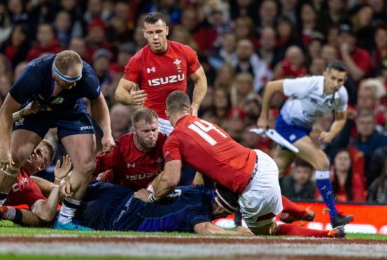 Scotland's captain Stuart McInally scores his side's try in Cardiff.