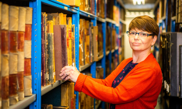 Senior archive assistant Lorna Westwater in AK Bell Library's archive 'strong room'