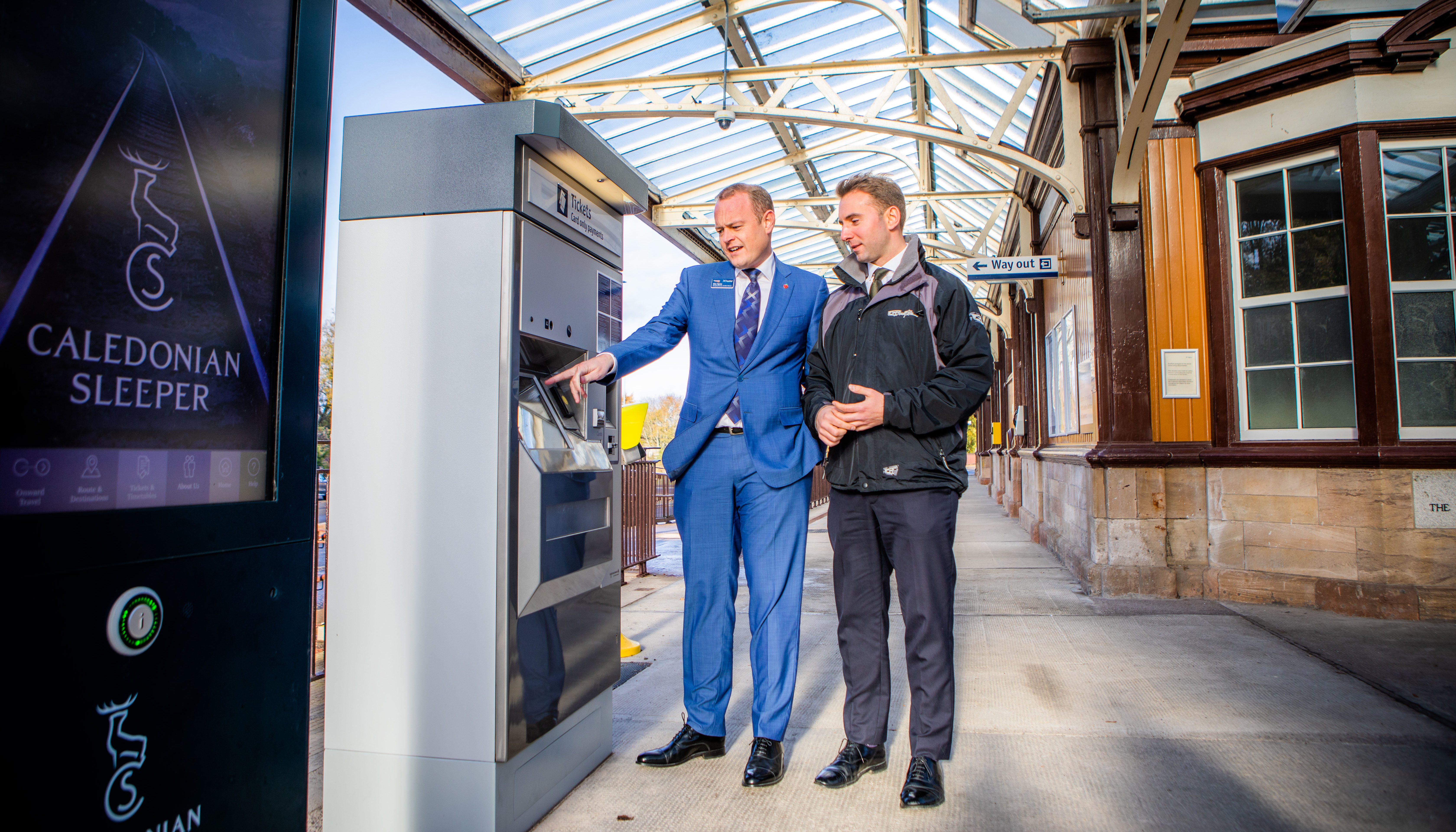 Alex Hynes, managing director of Scotrail with Conservative MP Luke Graham at the new machine.