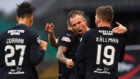 Kenny Miller celebrates with his team-mates after scoring the equaliser.