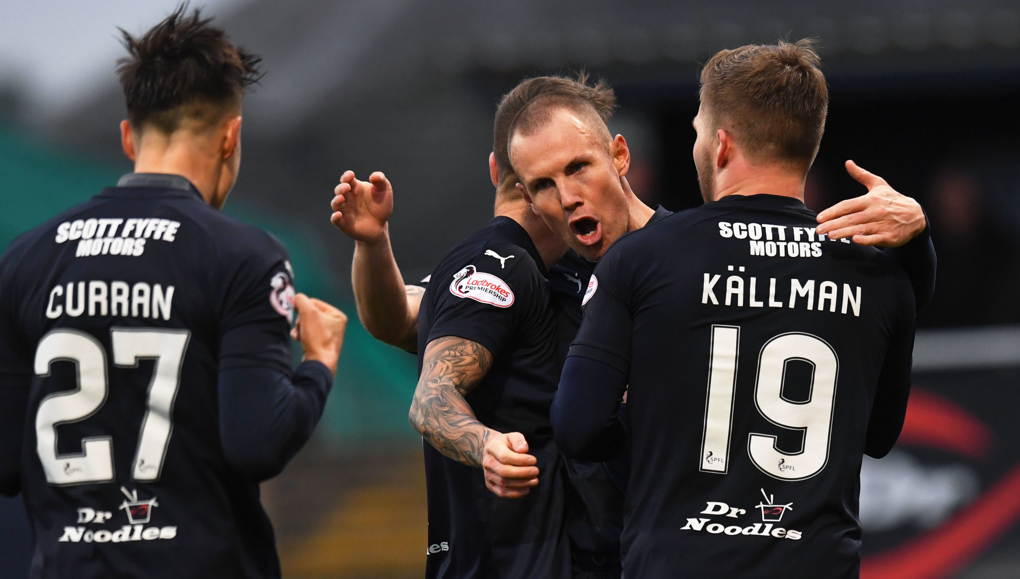 Kenny Miller celebrates with his team-mates after scoring the equaliser.