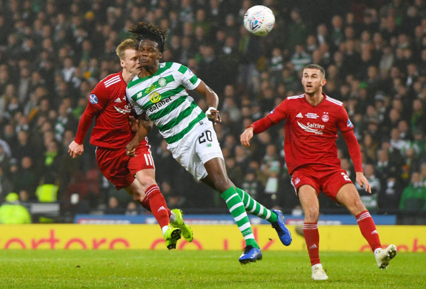 Aberdeen's Gary Mackay-Steven clashes heads with Celtic's Dedryck Boyata, with both players suffering injuries.