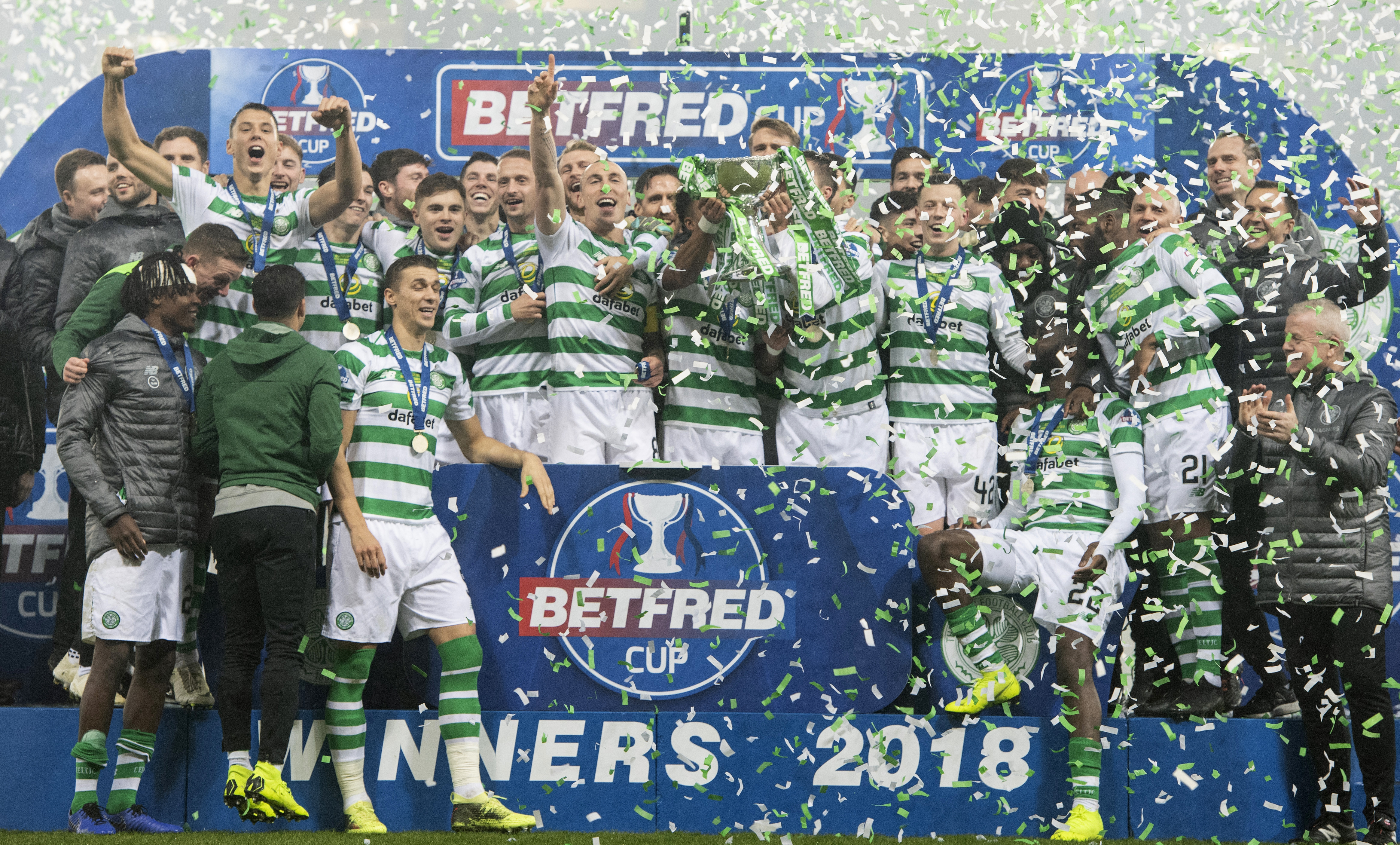Celtic's players celebrate winning the Betfred Cup.