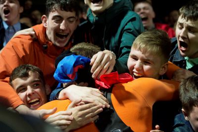 United striker Pavol Safranko is embraced by fans at full-time.