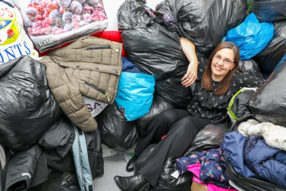 Pamela Sneddon is overwhelmed with the amount of coats donated at the drop-off points.
