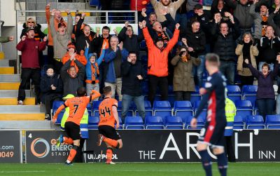 Paul Watson (No 44) celebrates his opening goal.