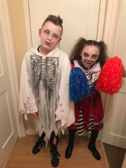 Dawn Slane sent in this photo of a zombie and a "dead cheerleader".