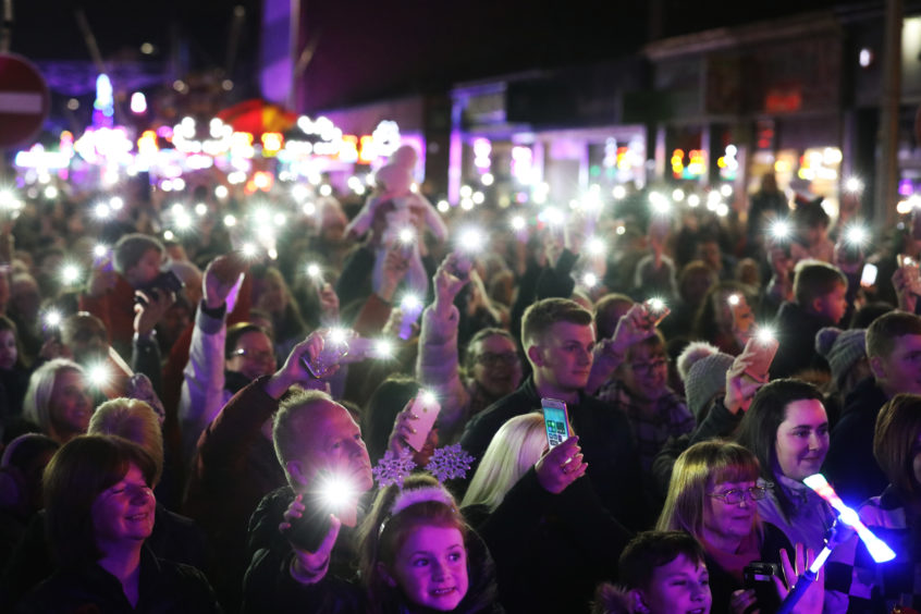 The crowd enjoying the show.