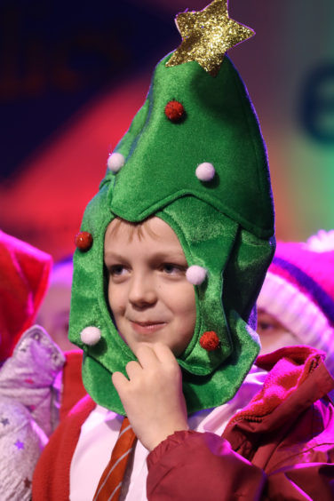 A pupil from Eastern Primary School sports a cool Christmas tree hat.