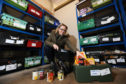 Perth and Kinross food bank coordinator Eleanor Kelleher preparing a parcel.