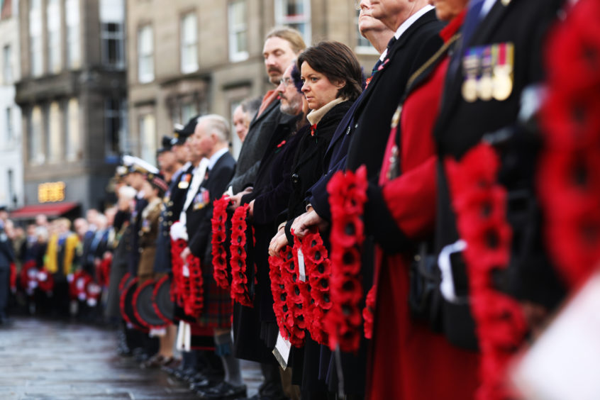 The Lord Provost, MSPs, local councillors and army personnel line up in wait to lay their wreaths in Dundee.