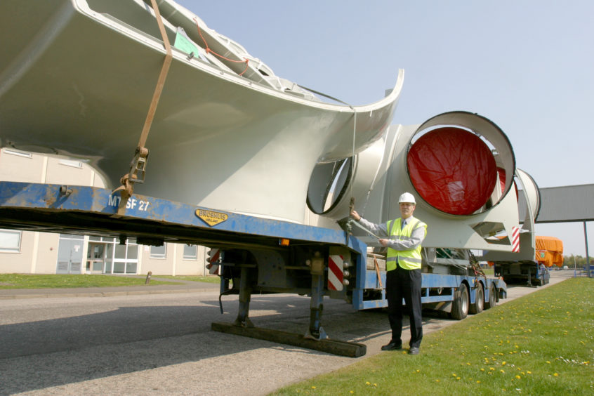 Parts of a wind turbine in the process of installation at Michelin Dundee, with engineering manager Bryan Bennett.