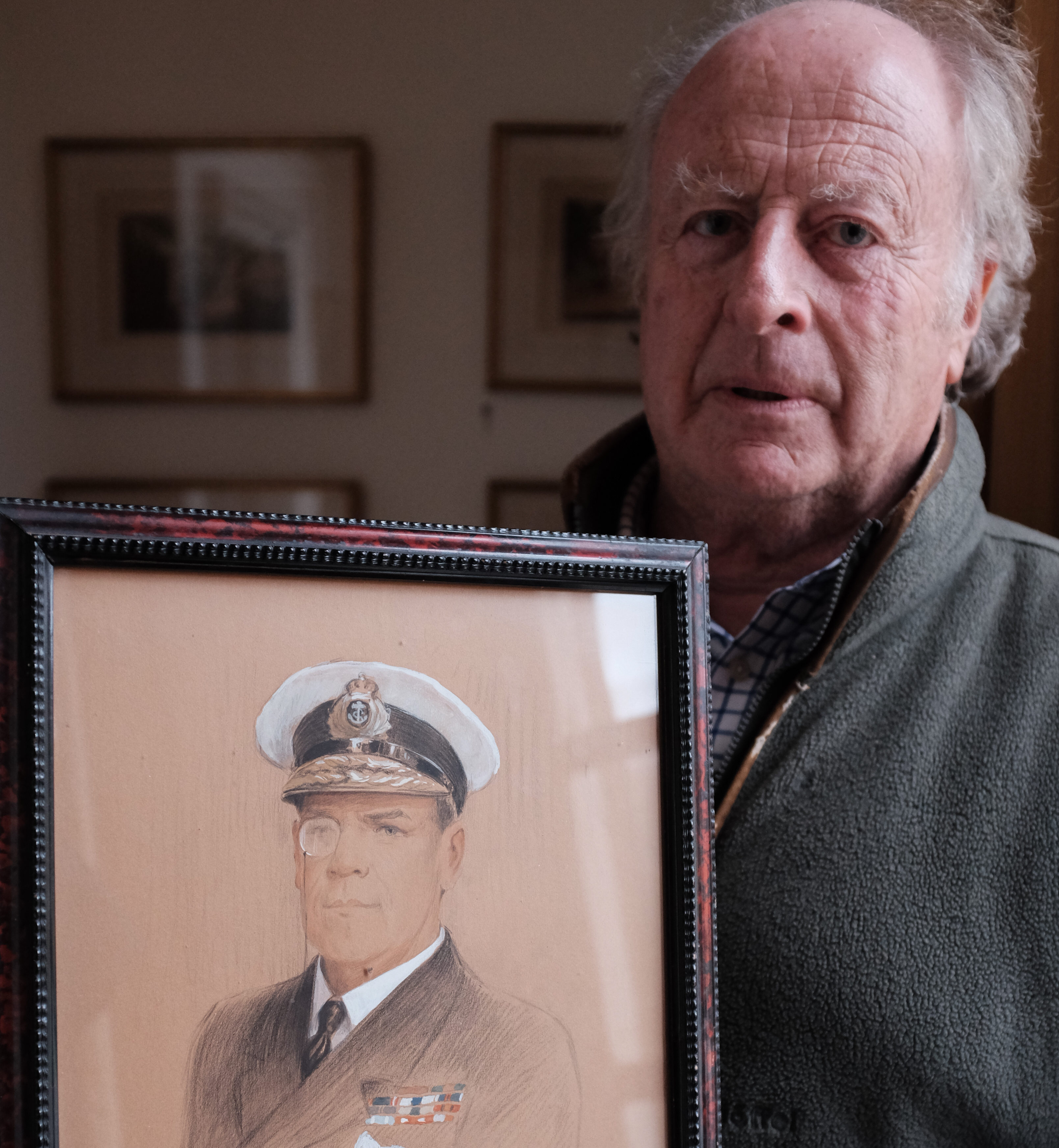 Michael Wemyss with a portrait of his great great uncle, Rosslyn Wemyss.