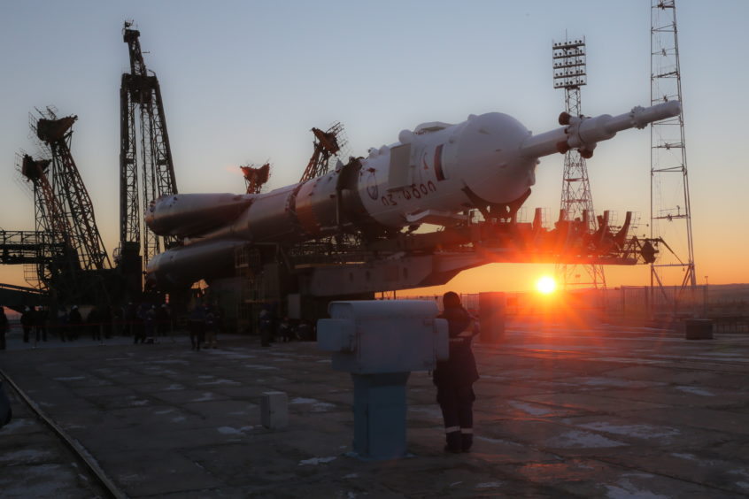 A Soyuz-FG rocket booster carrying the Soyuz MS-11 spacecraft being transported from an assembling facility to a launch pad at the Baikonur Cosmodrome.