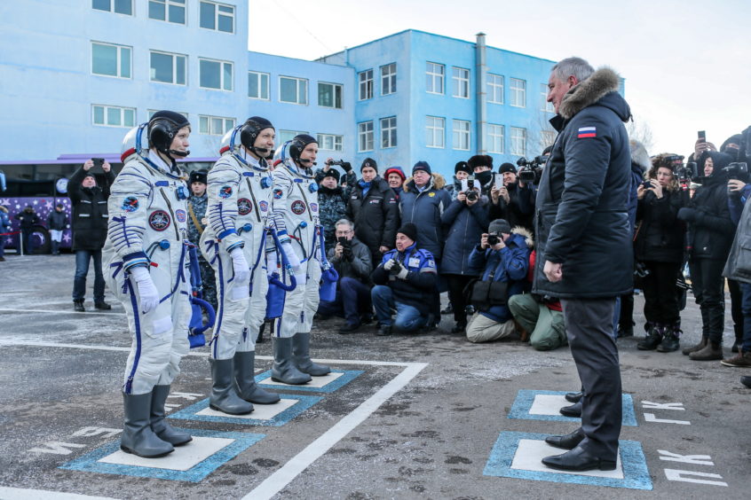 ISS Expedition 58/59 members, NASA astronaut Anne McClain, Roscosmos cosmonaut Oleg Kononenko, Canadian Space Agency (CSA) astronaut David Saint-Jacques, and Russian Federal Space Agency (Roscosmos) head Dmitry Rogozin before a launch of the ISS Expedition 58/59 crew to the International Space Station.