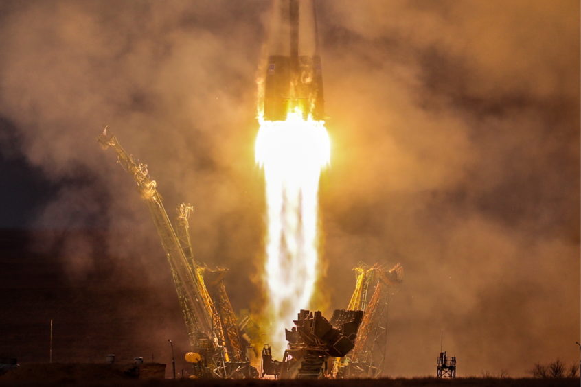 A Soyuz-FG rocket booster carrying the Soyuz MS-11 spacecraft with Roscosmos cosmonaut Oleg Kononenko, NASA astronaut Anne McClain, and Canadian Space Agency (CSA) astronaut David Saint-Jacques aboard lifts off to the International Space Station.