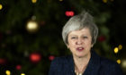 British Prime Minister Theresa May gives a speech after winning the confidence vote on December 12, 2018 in London, England.