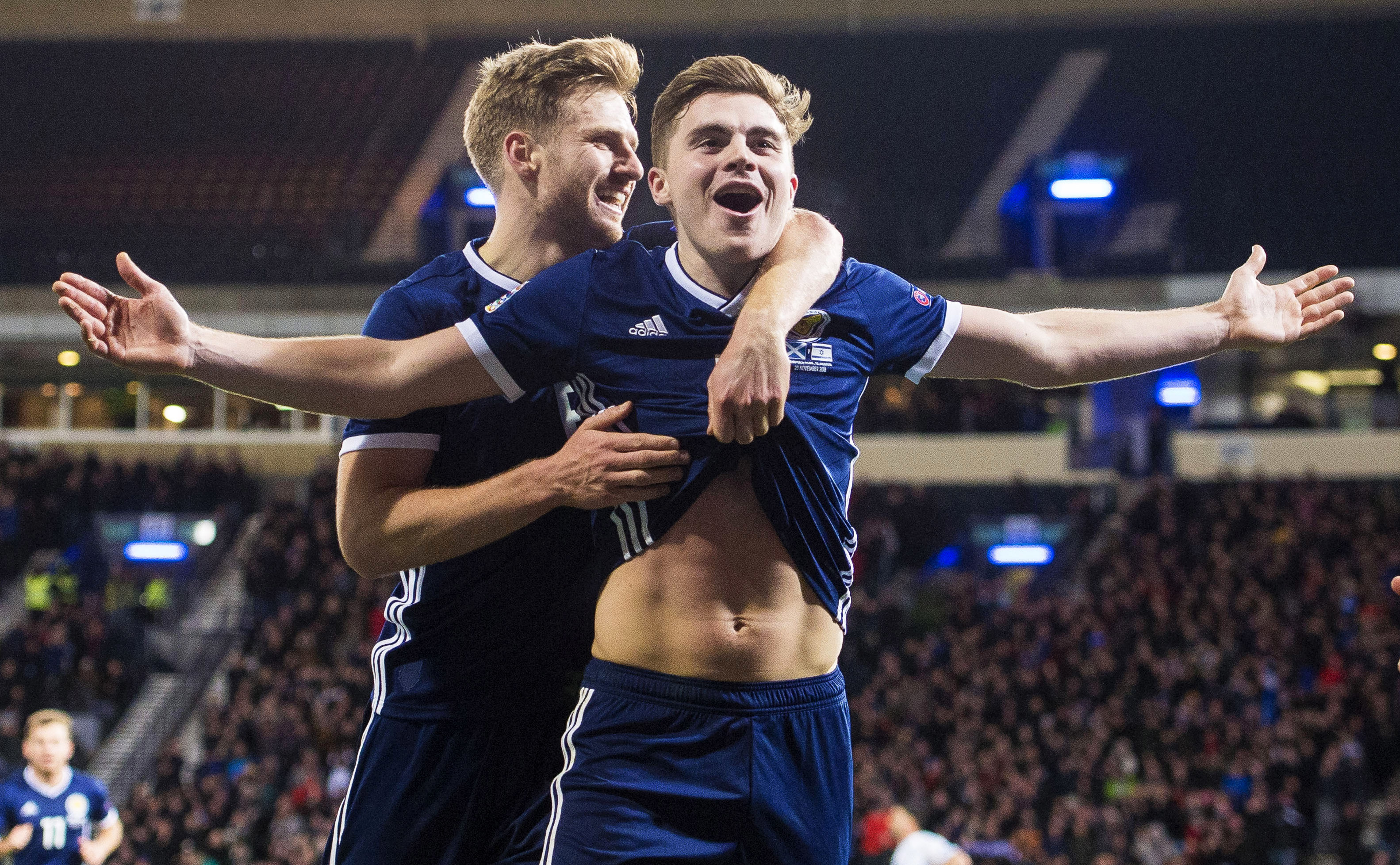 James Forrest is congratulated by Stuart Armstrong after helping Scotland win their Nations League group by beating Israel.