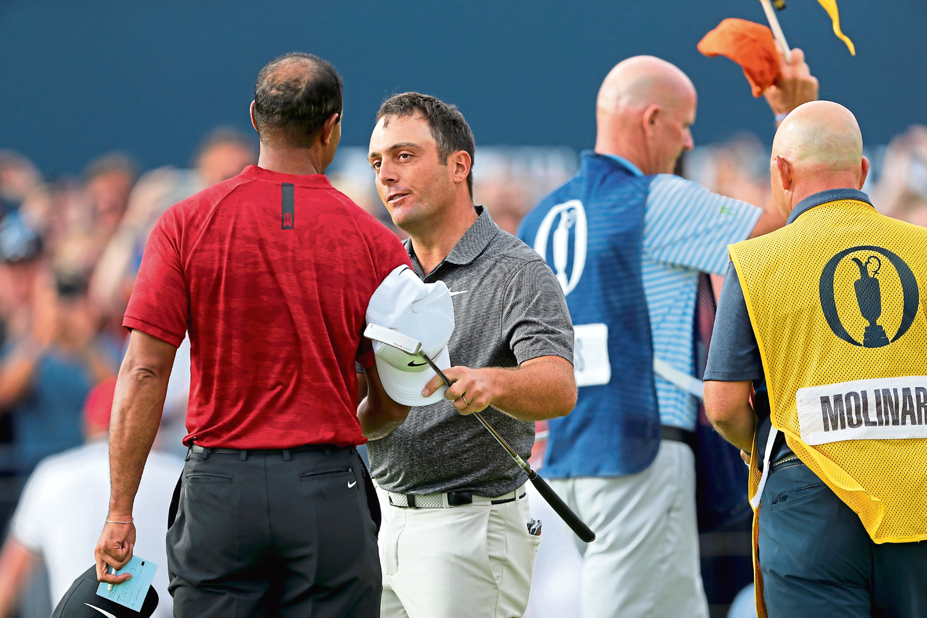 CARNOUSTIE, SCOTLAND - JULY 22:  Francesco Molinari of Italy shakes hands with his playing partner Tiger Woods of the United States during the final round of the 147th Open Championship at Carnoustie Golf Club on July 22, 2018 in Carnoustie, Scotland.  (Photo by David Cannon/Getty Images)